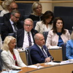 Swedish justice minister survives no-confidence vote