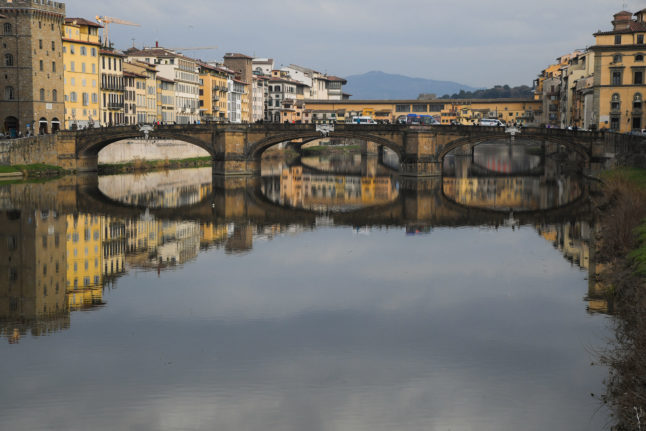 The Ponte Vecchio medieval arch bridge over the Arno river in Florence, Tuscany.