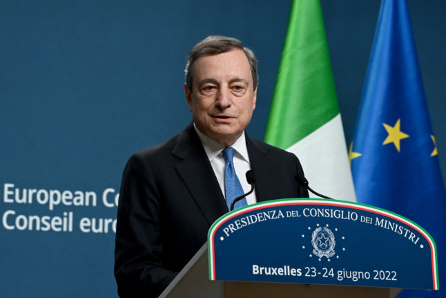 Italy's outgoing Prime Minister Mario Draghi holds a press conference at a European Union leaders summit in Brussels on June 24, 2022.