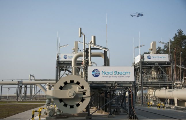 A helicopter flies over the Nordstream gas pipeline terminal in Lubmin