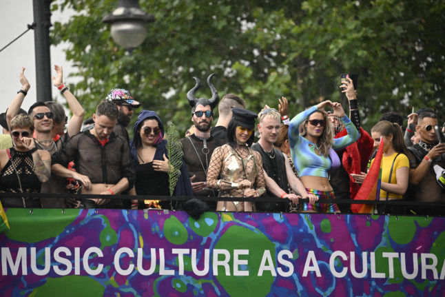 Participants celebrating during 'Rave the Planet' music parade in Berlin