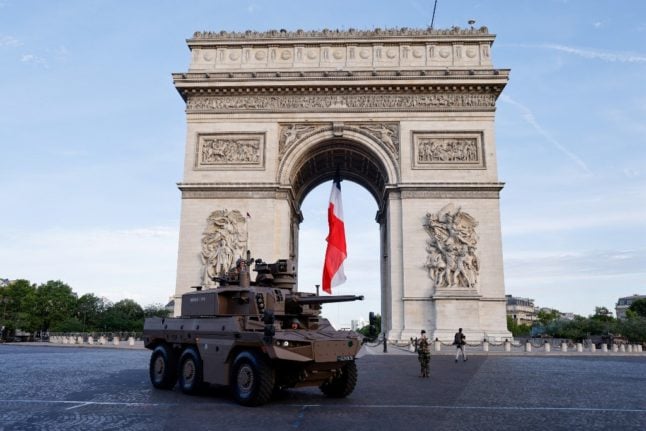 French military near the Arc de Triomphe ahead of the Bastille Day parade on the Champs-Elysees avenue in Paris on July 14, 2022.