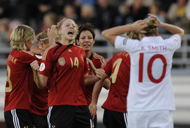 Germany's Kim Kulig (2ndL) celebrates after her teammate scores