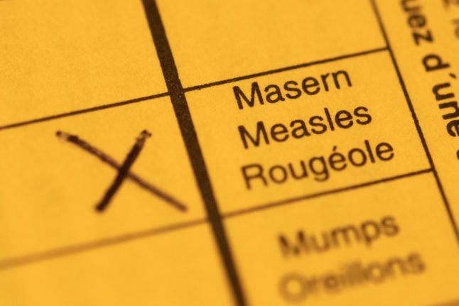 A vaccination pass with the measles box ticked.