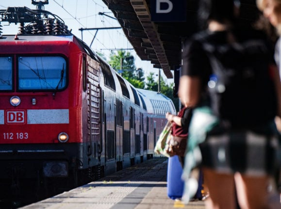 People wait for a regional train in Stralsund in early July.