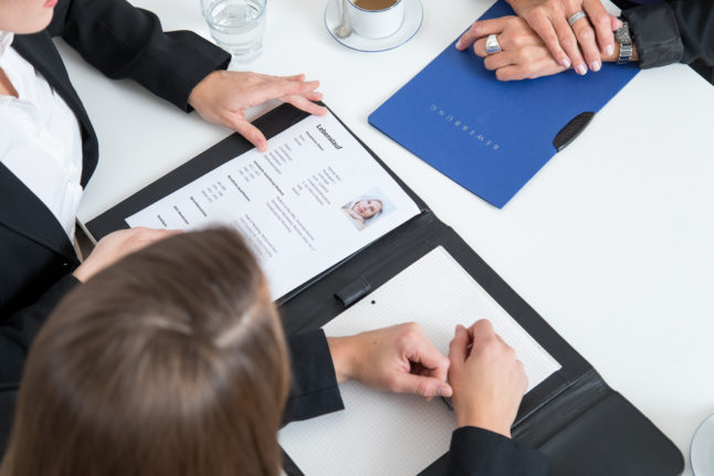 A person at a job interview in Germany.