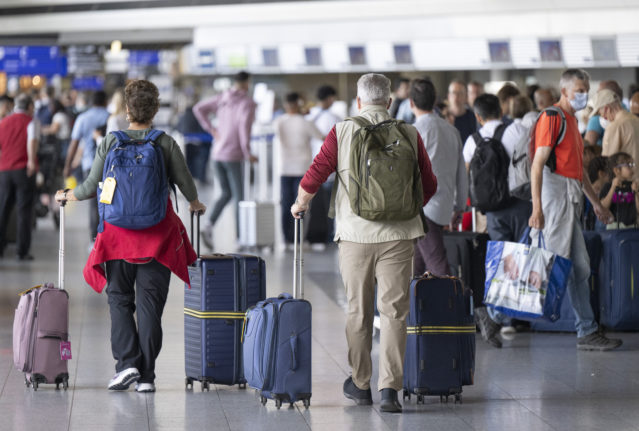 Passengers pass through Frankfurt Airport