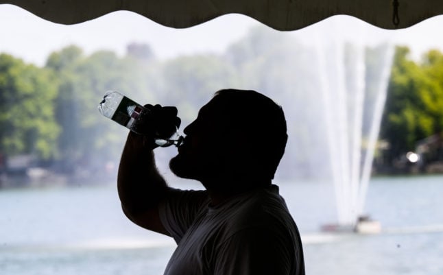 A man drinks water in Hanover on Tuesday.