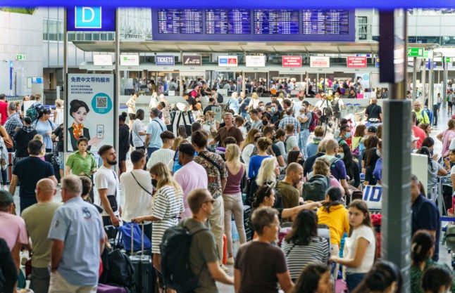 Travellers queue at terminal 2 of Frankfurt airport on July 23rd.