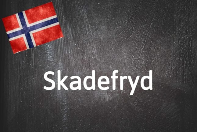 Pictured is Norway's word of the day, skadefryd, on a blackboard.