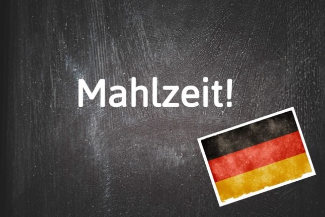 A blackboard with the word Mahlzeit on it