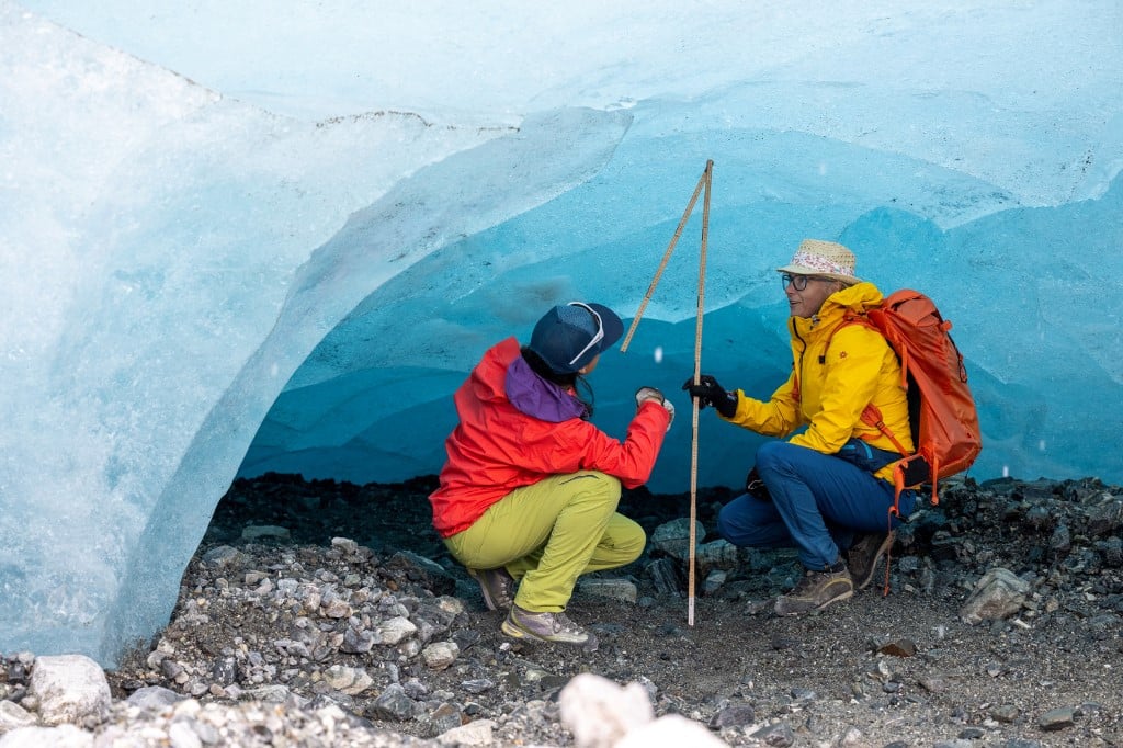 glaciologists measure ice shelf height under jamtal glacier