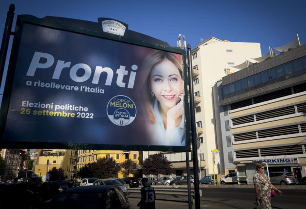 A campaign poster for Giorgia Meloni, far-right leader of the Brothers of Italy party, reads 'Ready to raise Italy up'.