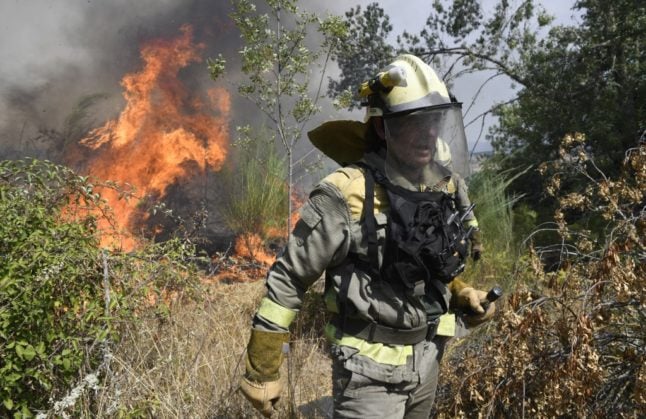 Spain wildfire forces evacuations and destroys land