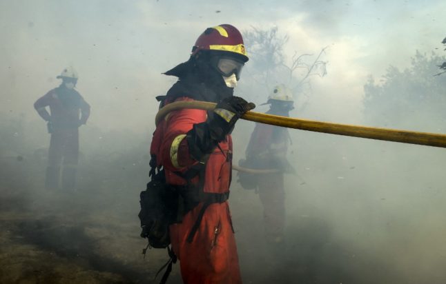 Firefighters battle to control huge wildfire in Spain's Valencia region
