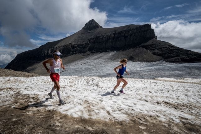 Runners on the last kilometres of a shortened version of Switzerland's Glacier 3000 run above Les Diablerets