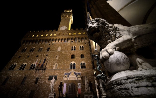 Florence's Palazzo Vecchio lit up at night. 