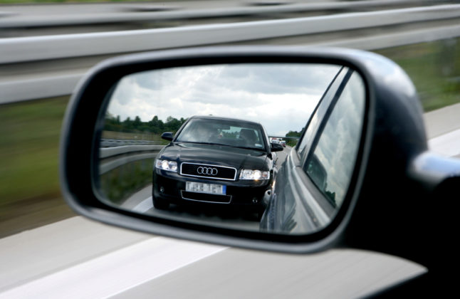 A tailgater can be seen in the wing mirror of a car traveling at on the A12 in Brandenburg