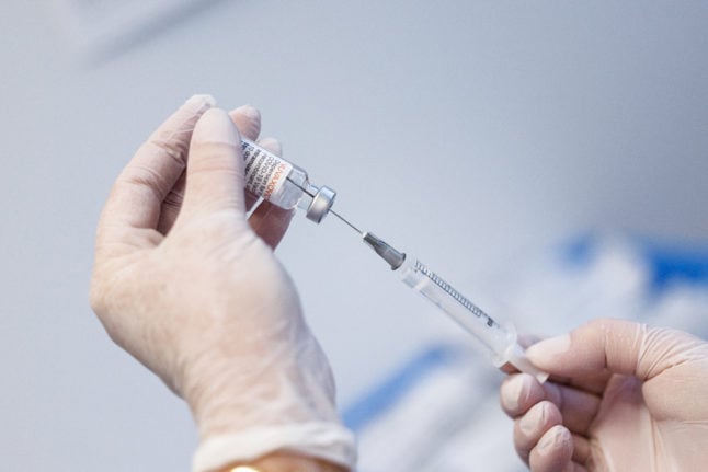 Nurse prepares dose of Pfizer vaccine