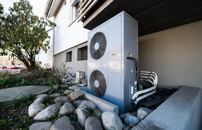 An air-source heat pump outside a house in Germany.