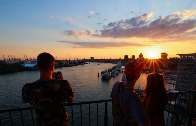 People enjoy the view on the Elbphilharmonie terrace in Hamburg.