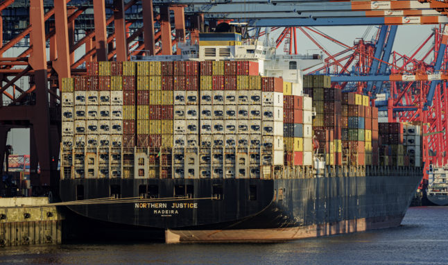 A container ship stands at the terminals in the port of Hamburg for clearance in May 2022.
