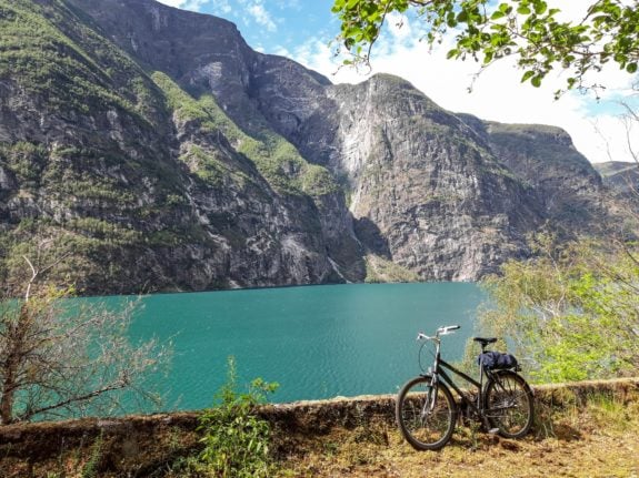 Pictured is a bike rested by the fjord in Norway.