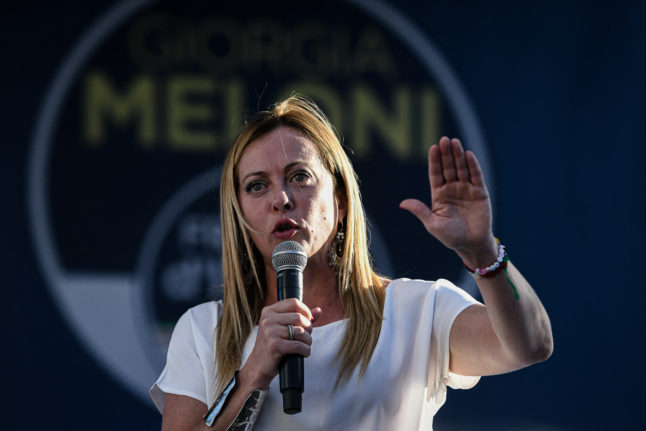 Giorgia Meloni, leader of the far-right Brothers of Italy party, addresses supporters in Milan on September 11, 2022.