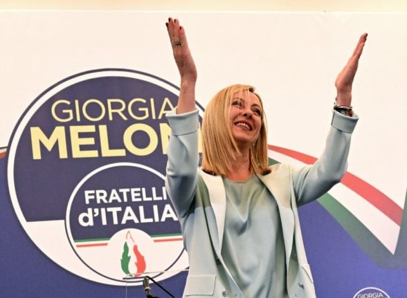 Leader of Italian far-right party "Fratelli d'Italia" (Brothers of Italy), Giorgia Meloni acknowledges the audience after she delivered an address at her party's campaign headquarters overnight on September 26, 2022 in Rome.