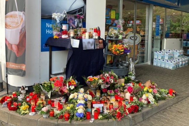 Tributes placed outside a petrol station in September 2021 after a cashier was murdered.