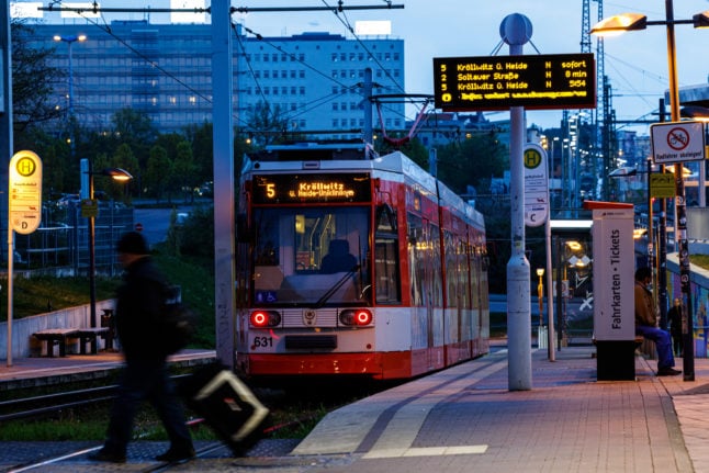 Passengers board a tram in Halle, Saxony-Anhalt. 