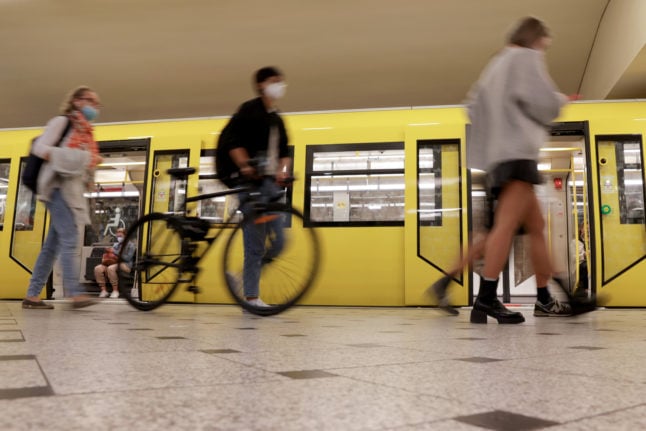 Passengers exit an U-Bahn train in Berlin