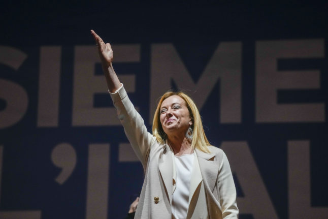 Giorgia Meloni, leader of the far-right Fratelli d'Italia party, gestures during the closing rally of the center-right bloc.