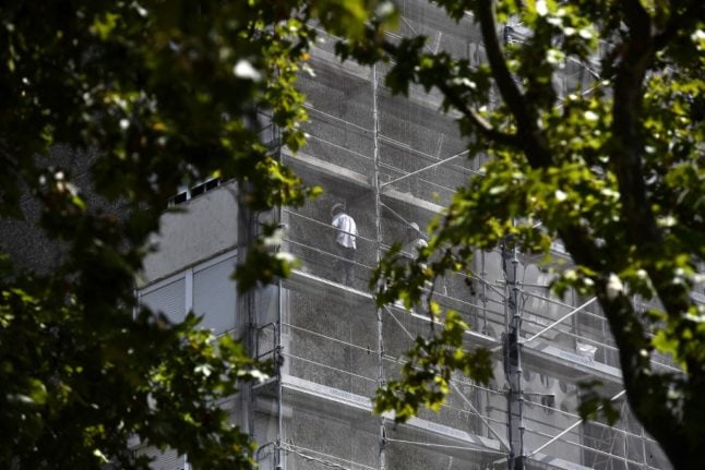 Worker standing on scaffolding in Spain.