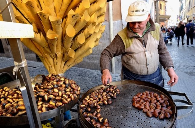 A street seller prepares roasted chestnuts in Rome.