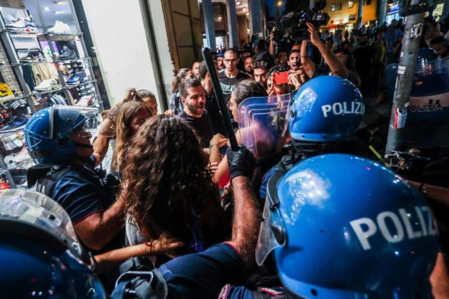 Demonstrators clashing with police at a Brothers of Italy rally in Palermo.
