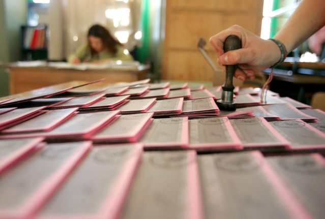 Ballot papers being stamped at an Italian polling station.