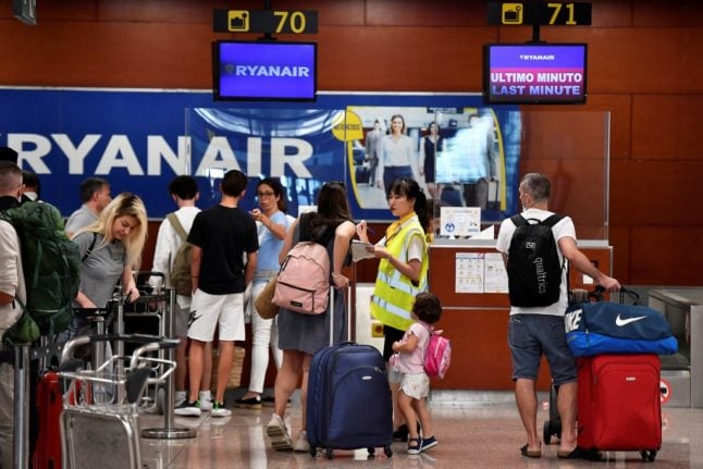 Ryanair check-in counters at Barcelona's El Prat airport.
