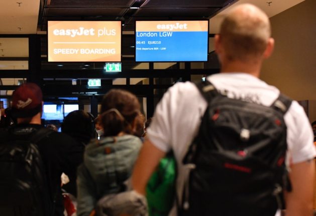 Passengers board for the first public flight operated by Easyjet at Berlin Brandenburg Airport Willy Brandt.