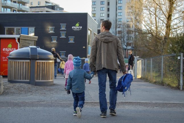 A man takes his son to kindergarten in Oslo.