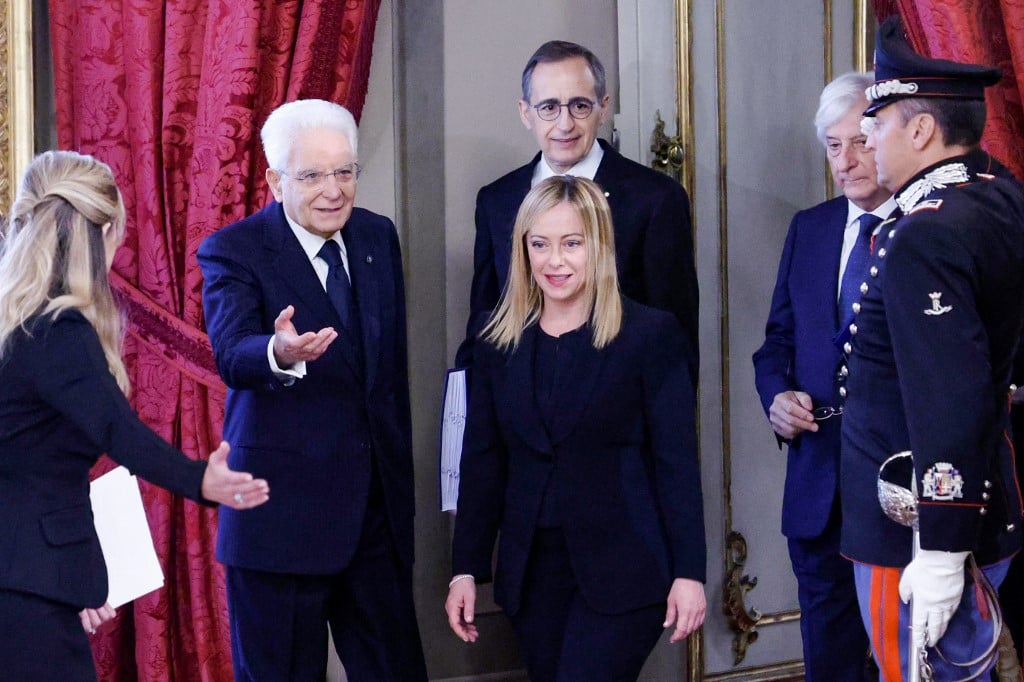 Italian President Sergio Mattarella (2nd L) welcomes new Prime Minister Giorgia Meloni (C) as she arrives for the swearing-in ceremony of the new Italian Government