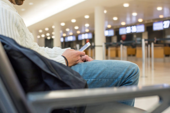 A passenger waits near border control at Bremen airport.