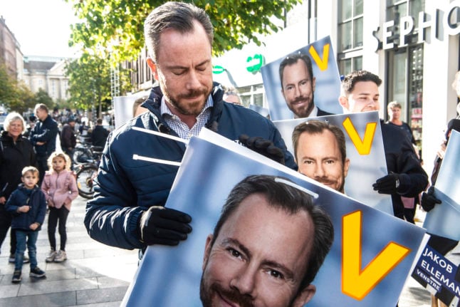 Leader of Venstre, Denmark's Liberal Party, Jakob Ellemann-Jensen hangs up election posters in Aarhus on 8th October 2022.