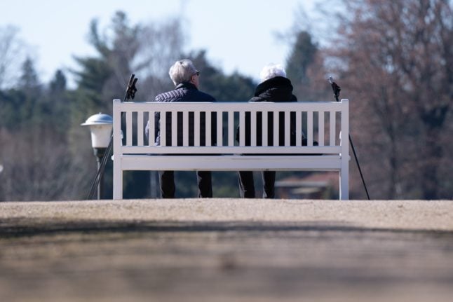 Pensioners sit on a bench in Dresden