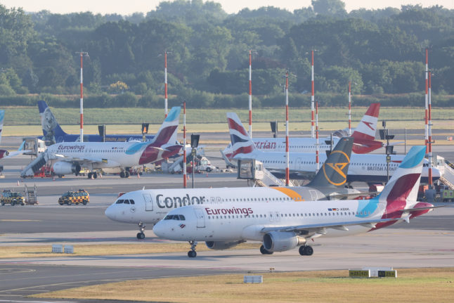 Airplanes, including a Eurowings plane, at Hamburg airport.