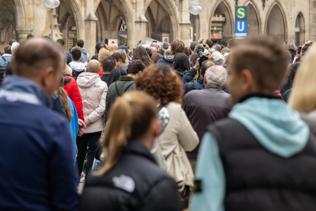 Pedestrians walking through central Munich.