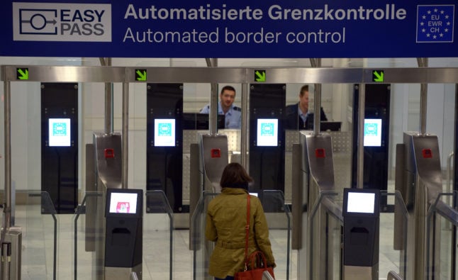 A woman passes through the automated passport control in EU