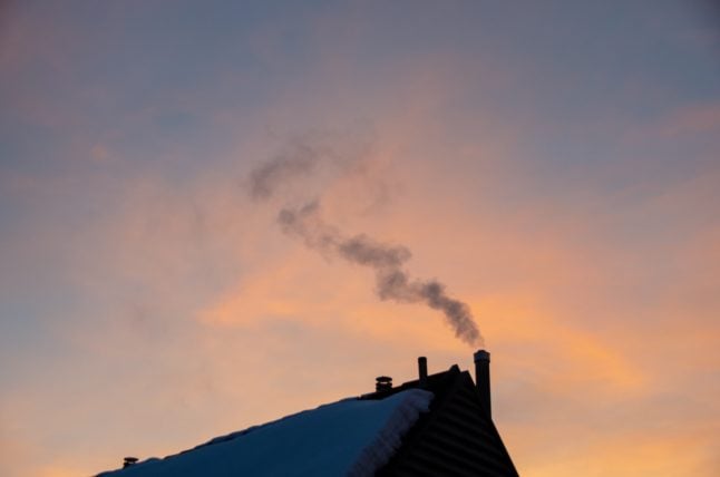 Pictured is smoke coming from a chimney