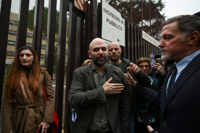 Journalist Roberto Saviano leaves a hearing in a defamation lawsuit from Italy's prime minister Giorgia Meloni.