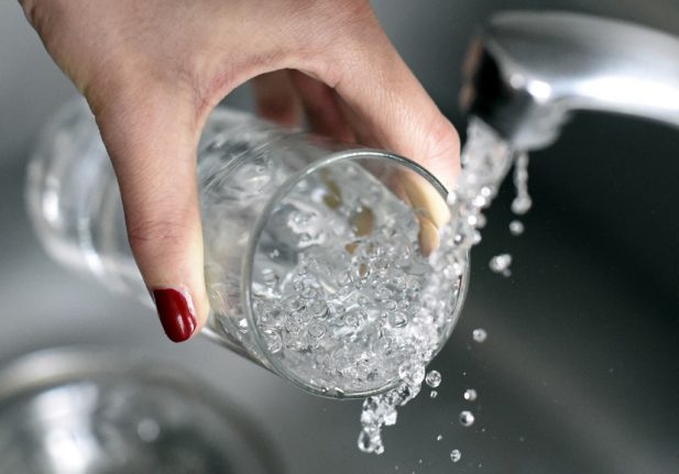Why does tap water taste strange in some parts of Spain?